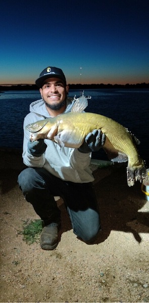 best greeley lawn care lawncare services owner Josh and fish he caught